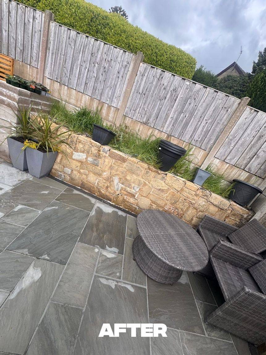 Stone garden wall after cleaning in Oldham