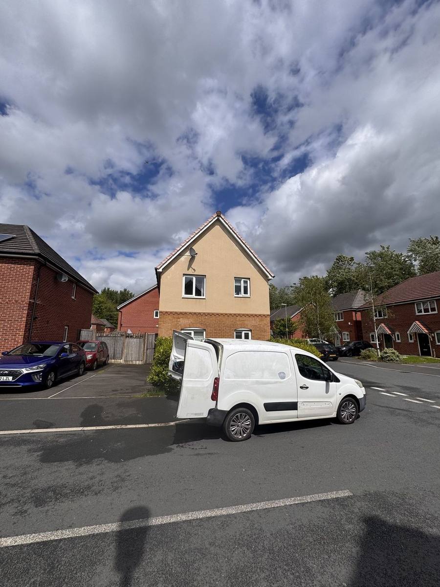 Soft washing a rendered house in Oldham