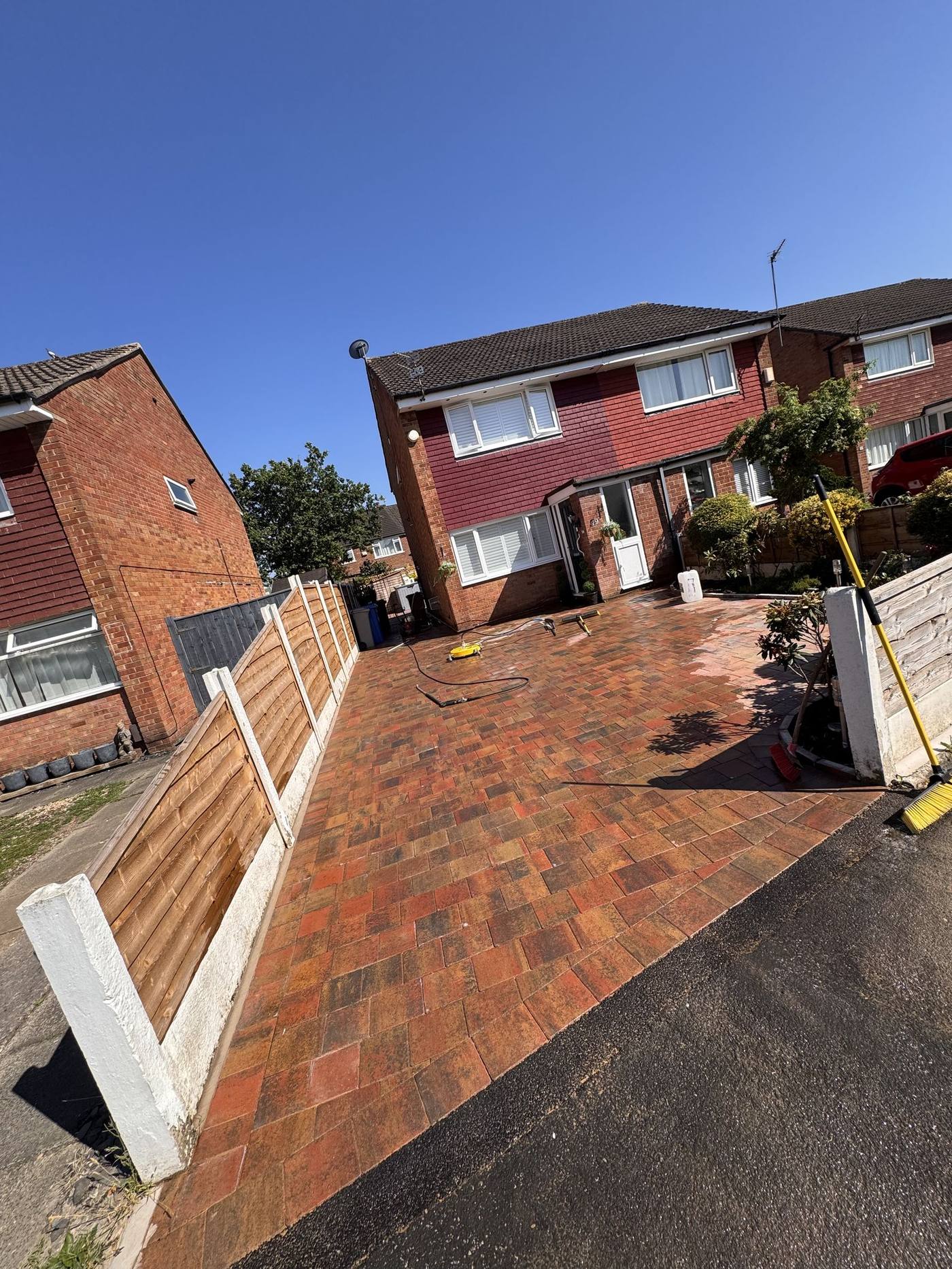 Brindle block paving driveway after professional driveway cleaning in Chadderton, colours fully restored on a Greater Manchester semi